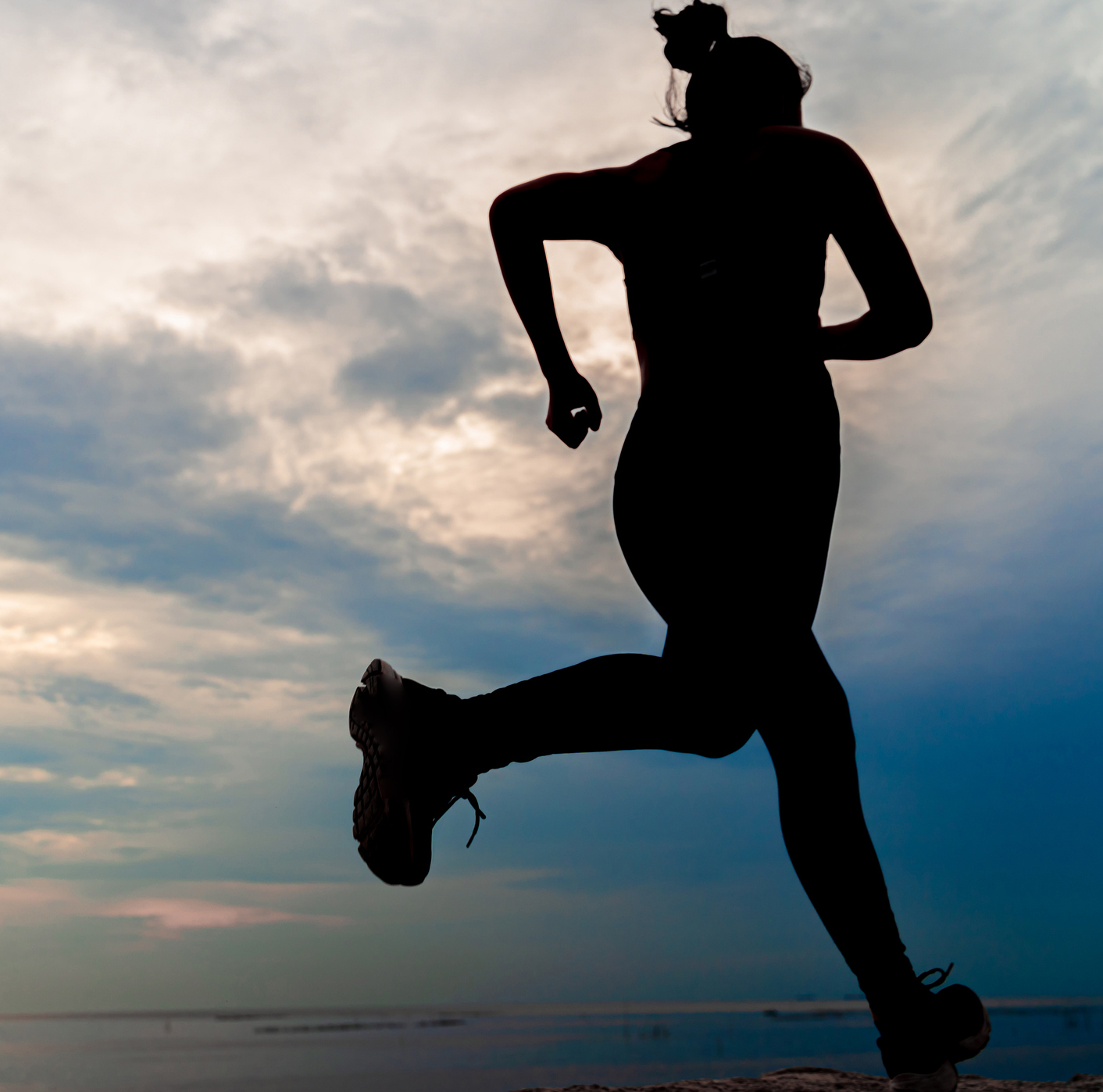 Silhouette Young Woman Jogging At Beach During Sunset treasure coast race series
